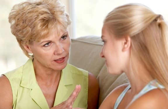 Older woman talking sternly to a younger woman