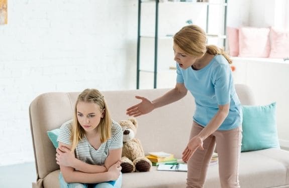 angry mom yelling at teenage daughter